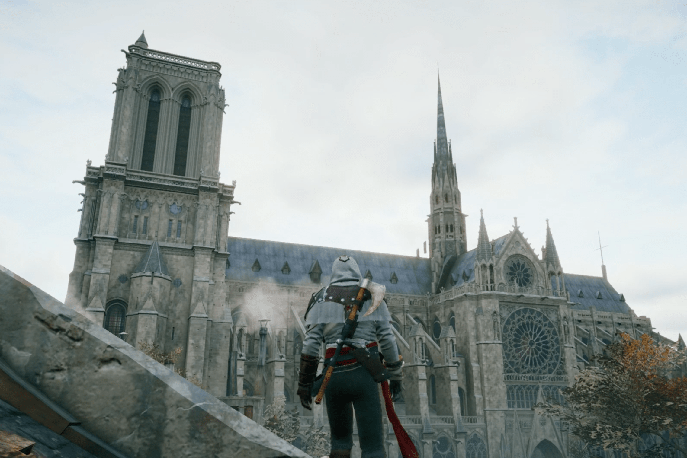 Arno standing on a rooftop and looking at Notre-Dame cathedral in Assassin’s Creed Unity